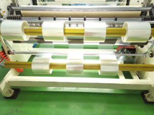 Protective film slitting machine in production at DCA Tape, a professional protective film manufacturer in China, processing PE, PET, PU protective film rolls