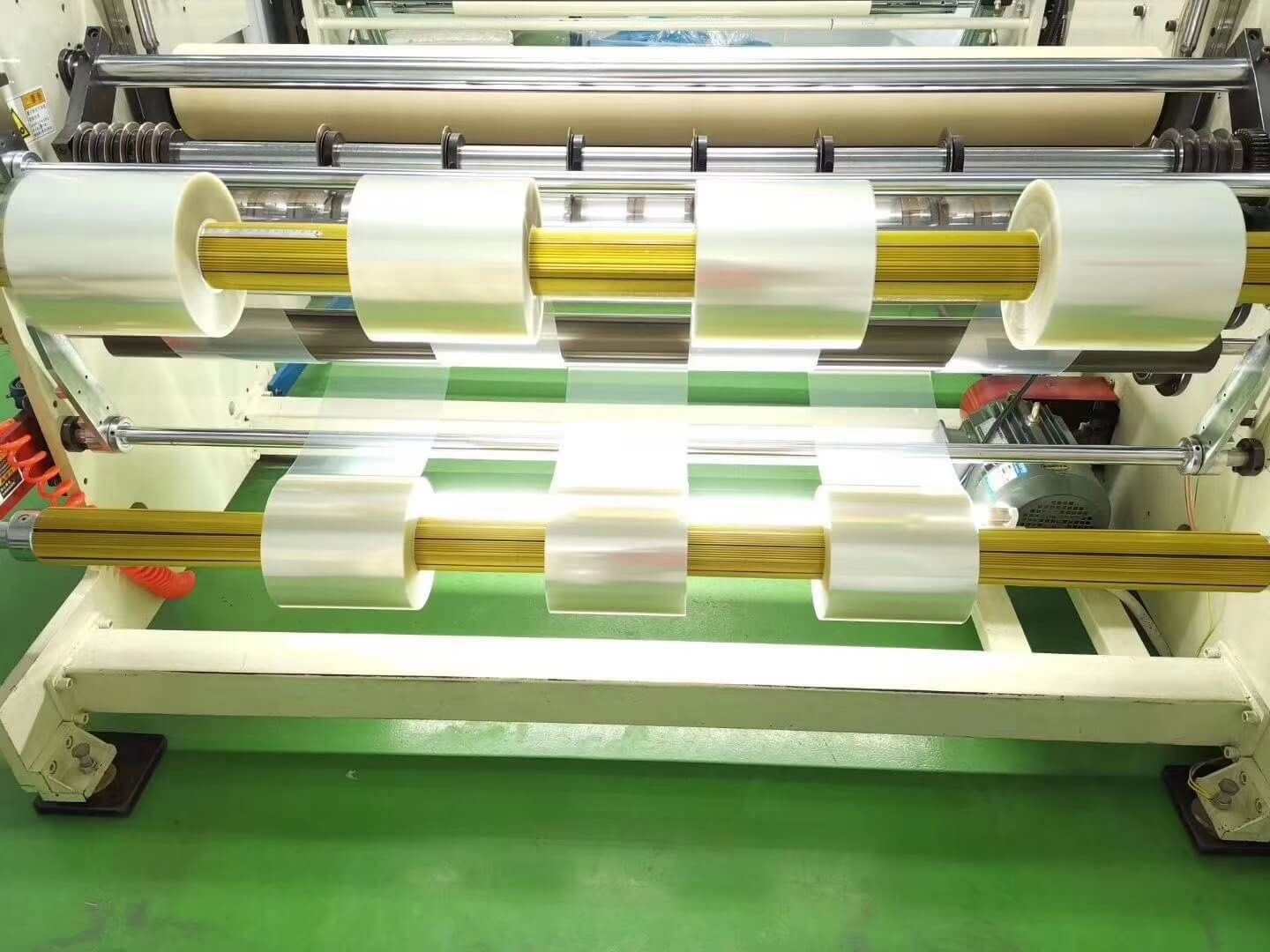 Protective film slitting machine in production at DCA Tape, a professional protective film manufacturer in China, processing PE, PET, PU protective film rolls