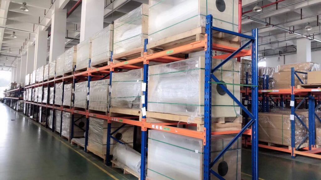 Protective film warehouse storage area at DCA Tape, a leading protective film manufacturer in China, with PE, PET, PU protective film rolls and finished products in stock
