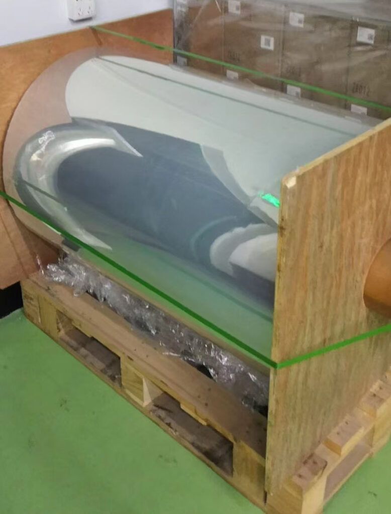 Large roll of transparent PET protective film packaged in wooden pallet at DCA Tape warehouse, China protective film supplier for global customers
